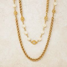 For Sale on 1stDibs - - Vintage item - Measures 94' long - Gold plated - Crystal accents - Faux pearls - By Chanel (signed on hangtag) - Made in France - Circa 1980s - Estate Luxury Pearl Necklace With Metal Chain, Luxury Pearl Chain Metal Necklace, Luxury Metal Pearl Chain Necklace, Luxury Metal Chain Necklace With Pearl Chain, Gold Long Necklace With Pearl Chain For Formal Occasions, Gold Long Necklace With Pearl Chain For Formal Events, Gold Pearl Long Necklace For Formal Occasions, Luxury Gold Chain Necklace With Pearl Charm, Classic Metal Pearl Necklace For Formal Occasions