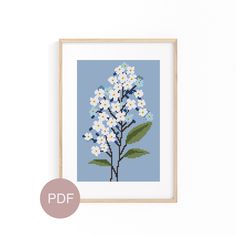 a cross stitch pattern with white and blue flowers