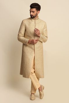 Golden sherwani with dori work embroidered motifs. Paired with front button placket kurta and straight-cut pant.
Component: 3
Pattern: Embroidered
Type Of Work: Dori work
Neckline: Mandarin collar
Sleeve Type: Full sleeves
Fabric: Raw Silk, Silk, Crepe
Color: Gold
Other Details: 
Side slits
Embroidered motifs
Front button placket
Occasion: Wedding - Aza Fashions Semi-stitched Gold Kurta With Naqshi, Gold Sherwani With Dabka Work Straight Kurta, Semi-stitched Gold Kurta With Naqshi Detailing, Designer Gold Sherwani For Eid, Gold Naqshi Straight Kurta, Gold Sherwani With Chikankari Embroidery, Gold Sherwani For Diwali Designer Wear, Designer Gold Sherwani With Chikankari Embroidery, Gold Raw Silk Sherwani With Chikankari Embroidery