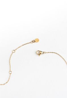 This shiny gold must-have necklace features a dainty chain adorned with chic 14K plated gold diamond-shaped pendants. Wear the All is Bright Necklace alone or layer it up for a touch of effortless shine to any outfit! Your purchase of the All is Bright Necklace to wear or to gift, gives survivors of human trafficking and exploitation the opportunity to build a bright sustainable life of freedom! Thank you! Box size and color may vary. Materials: 14k gold plated stainless steel necklace Hypoaller Gold Plated Initial Pendant Necklace With Delicate Chain, Gold Plated Layered Pendant Necklace With Delicate Chain, Gold Minimalist Layered Necklace With Round Pendant, Gold Initial Necklace With Adjustable Chain For Everyday, Minimalist 14k Gold Station Necklace, Delicate Adjustable Gold Chain Necklace, Delicate Gold Plated Charm Necklace With Delicate Chain, Delicate Gold-plated Layered Necklace, Delicate Gold Plated Layered Necklace