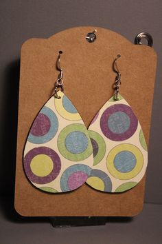 These earrings are light to wear and can come in many different designs and colors. They are made of wood with decoupage in a teardrop shape. Dress up your look or just show your interests off with a pair of these earrings.  They can be worn for any occasion such as weddings, parties, banquets, or just everyday wear. They also make a great gift for any special occasion. They sell out fast, so order yours today! Wood Decoupage, Decoupage Earrings, Abstract Ideas, Shape Dress, Paper Earrings, Dot Mandala, Mandala Painting, Paper Jewelry, Earring Crafts