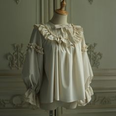 For a beautiful and elegant young lady. The blouse is richly decorated with frills and lace embroidery around her shoulders. Her sleeves have a relatively loose silhouette, and her chest is decorated with a ribbon. Her graceful beauty overflows. Bring romance to your everyday life. 
 
 

 

 
 
 Size 
 
 S size 
 
 Neck circumference: 40cm or less 
 Shoulder width: 38cm or less 
 Bust: 98cm or less 
 
 M size 
 
 Neck circumference: 45cm or less 
 Shoulder width: 42cm or less 
 Bust: 118cm or le Cottagecore Blouse With Lace Collar, Elegant Blouse With Ruffles And Ruffled Collar, Feminine Blouse With Ruffle Hem And Ruffled Collar, Feminine Blouse With Ruffled Collar For Formal Occasions, Formal Puff Sleeve Blouse With Ruffles, Formal Ruffled Puff Sleeve Blouse, Elegant Blouse With Ruffled Collar And Ruffle Hem, Feminine Formal Blouse With Ruffles, Feminine White Blouse With Ruffles