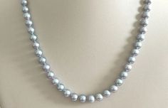 7mm AAA Round Chinese Akoya Silver Grey Pearls and 14K White Gold Clasp Classic Round Tahitian Pearl Necklace, Formal Gray Tahitian Pearl Jewelry, Classic Silver Pearl Necklace With High Luster, Gray Single Strand Jewelry With Round Beads, Gray Single Strand Pearl Necklace As Gift, Gray Single Strand Round Bead Jewelry, Classic High Luster Silver Pearl Necklace, Elegant Gray Round Pearl Necklace, Gray Round Necklace For Formal Occasions