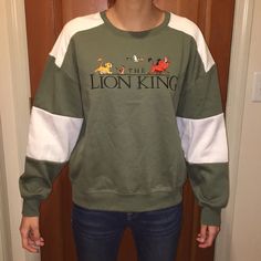 This Super Cute Lion King Shirt Is Perfect For Any Fan! It’s A Juniors Large, I Am Usually A Women’s Small And You Can See How It Fits On My In The First Pic, I’m Also 5’7. Any Questions Or If You Need More Pics Please Just Let Me Know! Casual Embroidered Tops For College, Sporty Embroidered Tops With Relaxed Fit, Embroidered Green Tops For Streetwear, Embroidered Long Sleeve Tops For College, Casual Green Tops With Embroidered Graphics, Casual Green Top With Embroidered Graphics, Trendy Long Sleeve Top With Embroidered Graphics, Long Sleeve Tops With Embroidered Graphics For College, Lion King Shirt