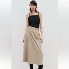 Long Skirt With Elastic Waist And Ruching. Side Patch Pockets With Flaps.Mid-Camel. Brand New With Tags. Full Waist 28” And Beyond . Full Hip 48” ,Length 35” Casual Khaki Maxi Skirt For Spring, Casual Beige Maxi Skirt For Fall, Beige Cargo Skirt For Spring Workwear, Fall Casual Beige Maxi Skirt, Casual Neutral Midi Skirt, Chic High Waist Khaki Skirt, Casual Neutral Skirt For Fall, Summer Workwear Khaki Cargo Skirt, High Waist Beige Maxi Skirt For Work