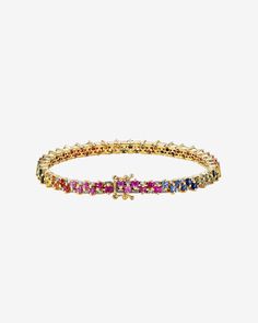 Introducing our Princess Mini Stack Tennis Bracelet, a fusion of elegance and everyday versatility. This bracelet, set with 4.80 carats of 2x2mm princess-cut rainbow sapphires and 0.95 carats of baguette white diamonds, is a statement of style. Details 18k rose gold or yellow gold 4.80 carats of 2x2mm princess-cut rainbow sapphires 0.95 carats of white diamond baguettes Bracelet measures 7" inches in length Box clasp with safety lock fastening Model is styling bracelet on right hand, second from Sapphire Tennis Bracelet, Baguette Bracelet, Diamonds Bracelet, Rainbow Sapphires, Vs Diamond, Box Clasp, Baguette Cut, Baguette Diamond, Tennis Bracelet