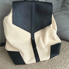 Never Used! Cheap Brown Flap Bag With Detachable Strap, Trendy White Canvas Backpack, Casual Rectangular Backpack For Shopping, Black Canvas Shoulder Bag For Spring, Casual Backpack With Snap Closure, Modern Black Backpack For Shopping, Black Backpack For Spring, Trendy Black Backpack For Summer, Casual Beige Backpack For Spring