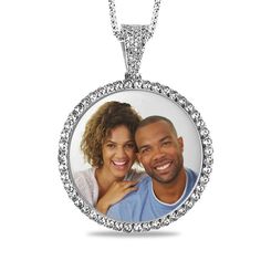 Pull out all the stops with this personalized gemstone photo pendant. Crafted in sterling silver, this charming look features a photo of your choice wrapped in a frame of shimmering white sapphires. All photo pieces are scratch resistant, 100% waterproof, and are available in high resolution color or black and white. Additional sapphires and beaded detailing adorn the bail. Buffed to a brilliant luster, this pendant suspends along an 18.0-inch rope chain that secures with a spring-ring clasp. Pl Customizable Silver Jewelry For Keepsakes, Customizable Silver Round Pendant Jewelry, Customizable White Gold Round Pendant Jewelry, Customizable White Round Jewelry, Personalized Round Pendant Jewelry, Customized Silver Medallion Jewelry, Personalized White Gold Jewelry With Diamond Accents, Customizable Sterling Silver Jewelry, Keepsake Round White Gold Jewelry