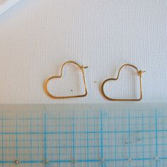 "Heart shaped hoops, lightweight and minimalist. Choose from three sizes and from sterling silver, 14k gold fill or rose gold fill. Super lightweight, you won't even know they are there. Small .75\" Medium 1.25\" Large 1.75\" Metal: Choose from sterling silver, 14k gold fill, rose gold fill Earring Replacements If you were to lose an earring, I will be happy to make a matching one for half price and free shipping! All orders come packaged ready for gift giving. In order to keep down on waste, or Minimalist Hoop Earrings With Heart Charm, Minimalist Nickel-free Hoop Earrings For Valentine's Day, Minimalist Small Hoop Heart Earrings, Minimalist Hoop Earrings For Valentine's Day, Gold Small Hoop Heart Earrings In Minimalist Style, Minimalist Heart Jewelry With Ear Wire, Minimalist Gold Small Hoop Heart Earrings, Minimalist Open Heart Earrings, Everyday Heart-shaped Hoop Earrings