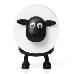 a black and white sheep with big eyes on it's head, standing in front of a white background