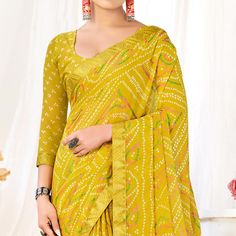 Lemon Yellow colored saree is made from chiffon fabric which is highlighted with beautiful bandhani printed work as shown. Comes along with unstitched chiffon blouse piece which you can customise as per your design/style. Occasion - You can wear this saree for casual and daily wear. Note:- the actual product may differ slightly in color and design from the one illustrated in the images when compared with computer or mobile screen. Measurements: Saree : Chiffon : 5.5 Mtrs Blouse : Chiffon : 0.8 Mtr Material: Chiffon Stitch Type: Unstitched Country of Origin: India Care Guide: Dry Clean Printed Chiffon Saree, Saree Chiffon, Blouse Chiffon, Mobile Screen, Chiffon Saree, Chiffon Blouse, Lemon Yellow, Print Chiffon, Chiffon Fabric