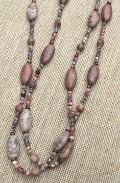 "Long oval leopard skin jasper beads. Approximately 18 to 20mm x 9mm. These are spaced with faceted 3mm leopard skin jasper beads, 6mm round leopard skin jaspers beads also 4mm etched Czech beads And Czech o-beads.   This necklace is approximately 33\" long. Sterling silver findings and extension chain." Blossom Bracelet, Leopard Skin Jasper, Leopard Skin, Purple Jade, Jasper Necklace, Hippie Necklace, Long Beaded Necklace, Jasper Beads, Czech Beads