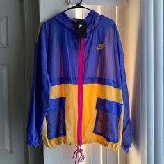 Nwt Purple/Pink/Yellow Color Blocked Nike Windbreaker. Never Worn. Can Cinch The Bottom. Casual Pink Patchwork Windbreaker, Patchwork Nylon Windbreaker For Spring, Spring Nylon Color Block Outerwear, Pink Hooded Nike Windbreaker, Casual Pink Nike Windbreaker, Nike Pink Long Sleeve Windbreaker, Sporty Pink Patchwork Outerwear, Spring Windbreaker With Patchwork, Nike Purple Outerwear For Streetwear