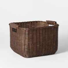 a brown wicker basket on a white background