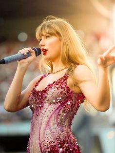 taylor swift performs on stage at the super bowl