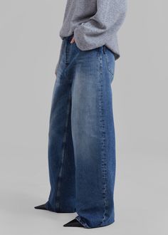 Color: Mid Blue Midweight cotton denim Relaxed fit Wide leg Slant hip pockets Back patch pockets Distressed hem Front button closure Unlined 100% Cotton Gentle Machine Wash Cold By Haikure. Made in Italy Indigo Baggy Wide Leg Bottoms, Mid-rise Medium Wash Bottoms With Five Pockets, Relaxed Fit Wide Leg Flare Jeans In Recycled Denim, Baggy Washed Blue Jeans With Patch Pockets, Baggy Mid-rise Rigid Denim Jeans, Baggy High-rise Dark Wash Jeans, Baggy Indigo Denim Jeans, Straight Leg Rigid Denim Bottoms With Frayed Hem, High Rise Baggy Dark Wash Jeans