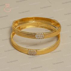 Solid 14k Yellow Gold Bangle Handmade Real Diamond Jewellery Women's Bangle Bracelet Wedding Gift New Designer Jewelry Trendy Gold Bangle BAMJ-344 Price & Details FOR ONE BANGLE GrWt : 16.44Gm Gold Wt : 16.23gm Diamond Wt : 1.03ct Diamond Pcs : 54ct Size : 65 MM ✦ This is the perfect gift for mom, wife, fiancée, girlfriend, valentine, daughter, family or friend. It is a special gift for mother's day, valentine's day, wedding, anniversary, birthday, Christmas, Easter, New Year's and any holiday. ✦ Custom Orders : Since most products are handmade and made by members of my shop , you can ask us any kind of customization. You can choose from 14k Gold, 925 Silver And Diamond. For most of the items. Gemstone can be changed as per your preferences. ✦Thank You for visiting our shop. ❤ Luxury Yellow Gold Bangle With Elegant Design, Gold Bracelet Jewelry For Wedding, Gold Wedding Bracelet Jewelry, Gold Plated Bridal Set For Anniversary, Classic Gold Jewelry For Wedding, Gold Bangle Cuff Bracelet For Wedding, Gold Plated Bangle Bracelet For Wedding, Gold-plated Gold Bracelets For Wedding, Gold Bangle Jewelry For Wedding