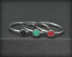 This beautiful dainty ring is made from sterling silver and features a small 4mm synthetic opal or Swarovski crystal that has been set in a sterling silver bezel. You can choose to have the finish of the band to be hammered or left smooth. It can be worn alone or with my other stacking rings. • sold individually• sterling silver, synthetic opal, Swarovski crystal• birthstone/opal: 4mm• band width: 1.3mm Don't know your ring size? Purchase a Reusable Ring Sizer *This is a made to order item. Plea Silver Adjustable Opal Ring, Adjustable Dainty Stackable Rings With Polished Finish, Dainty Adjustable Stackable Rings With Polished Finish, Silver Adjustable Opal Ring With Round Band, Dainty Stackable Sterling Silver Opal Ring, Adjustable Sterling Silver Midi Rings With Birthstone, Silver Opal Ring With Adjustable Band, Dainty Stackable Rings With Polished Finish, Classic Sterling Silver Opal Birthstone Ring