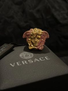 Authentic Versace 3d chunky pink crystals Medusa gold ring  Colour: 18k gold plated Year: 2000s Made in Italy  engraved Versace inner the ring  Condition rating: N (Brand new) tag still on!  (check our vintage rating scale in the photos)  Comes with original Versace  box.  Measurements below ring size: US 8 1/2 3.6cm x 3.6cm x 3cm  P.s   1) What you see here is what you going to received!!  2) All vintage sales are final.  Message us or email us anytime you needed help. Luxury Pink Jewelry Collectible, Luxury Pink Collectible Jewelry, Designer Pink Gold Jewelry Gift, Designer Pink Gold Jewelry As A Gift, Pink Gold Plated Ring, Vintage Versace Aesthetic, Versace Aesthetic, Medusa Versace, Rating Scale