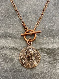 St. Joan of Arc Necklace Solid bronze chain and medal Bronze Medallion Necklace With Coin Pendant, Bronze Coin Pendant Medallion Necklace, Bronze Medallion Necklace With Adjustable Chain, Bronze Metal Medallion Necklace, Antique Finish Copper Medallion Jewelry, Bronze Metal Necklace With Coin Pendant, Nickel-free Copper Medallion Necklace, Antique Copper Medallion Necklace, Bronze Copper Medallion Jewelry