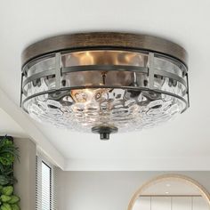 a light fixture in the middle of a room