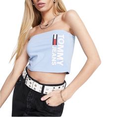 Nwt Tommy Jeans Logo Bandeau Founded In 1985, All-American Brand Tommy Jeans Is Best Known For Its Preppy Vibe And Iconic Red, White And Blue Logo. Branching Out, The Brand Has Stepped Up Its Collections To Include Everything From Clothing And Accessories To Lingerie And Fragrances. Women's Size Large Short And Sweet Bandeau Style Logo Print Detail Cropped Length Slim Fit Blue Bandeau Tank Top For Spring, Spring Blue Bandeau Tank Top, Trendy Blue Bandeau Top, Casual Blue Bandeau Tank Top, Blue Casual Crop Top Tube Top, Trendy Blue Crop Tube Top, Casual Blue Crop Top Tube Top, Spring Trendy Tommy Hilfiger Tops, Trendy Tommy Hilfiger Tops For Spring