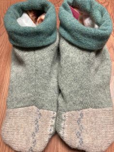 "These slippers are the coziest. They are made from  recycled wool sweaters (washed/felted, taken apart and redesigned),  are fleece lined and even have recycled leather on the sole for a non-slip bottom. The cuff ensures that they keep ankles warm, and don't slip off as some slippers do!   These are a size Large which will fit a foot sizes 9-10.5;they do stretch, since they're made out of sweaters! The bottom sole measures about 11\" long. you can even wash these; lay flat to dry.  I can also m Sweater Slippers, Recycled Wool Sweater, Barefoot Shoes, Recycled Leather, Wool Sweater, Wool Sweaters, 9 And 10, Lay Flat, Clothing Items