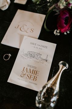 the wedding stationery is laid out on the table for guests to sign their names