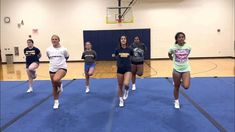 the girls are practicing their moves on the basketball court