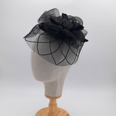 Discover the Exquisite Black Diamond Veil Fascinator Hat - a stunning combination of classic charm and contemporary style. This masterpiece is perfect for fashion enthusiasts who want to make a statement. The black diamond pattern adds sophistication, while the delicate goose feathers and glamorous black polka dot veil exude elegance and mystery. Whether you're attending a chic soirée, a Derby event, or a vintage-themed wedding, our Veil Fascinator Hat is the perfect accessory to enhance any outfit. It's crafted with meticulous attention to detail, ensuring both comfort and style. The lightweight design guarantees hours of comfortable wear. Wear the matching headband or use the hair clip to attach it to your hair. Embrace the allure of the Exquisite Black Diamond Veil Fascinator Hat, you'l Black Cloche Wedding Hats And Headpieces, Black Cloche Wedding Hat, Black Cloche Costume Hat For Wedding, Black Cloche Fascinator For Party, Black Cloche Party Hat, Black Cloche Fascinator For Evening, Black Evening Cloche Fascinator, Elegant Black Mini Hat For Church, Adjustable Black Fascinator For Races