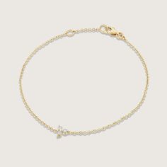 This gorgeous, dainty bracelet is the one piece of jewelry no woman can resist. It is subtle, while still exuding elite design.  Delicate and beautiful 14K gold chain which displays a central floral shaped element with 3 natural white diamonds. This minimalist design,is a great gift idea for any special occasion, an anniversary gift or even a birthday gift that shows how happy you want to make her.  ------------------------- Features: 14K gold Natural white Diamonds Total diamond weight: 0.09 ca Delicate Gold Diamond Bracelet For Formal Occasions, Elegant 14k Gold Bracelet With Delicate Chain, Dainty Yellow Gold Chain Bracelet, Dainty Yellow Gold Diamond Bracelet, Dainty Yellow Gold Bracelet, Delicate 14k Gold Bracelet With Delicate Chain, Classic Diamond Bracelet With Delicate Chain, Delicate Yellow Gold Bracelet For Formal Occasions, Delicate Chain Bracelet For Formal Occasions