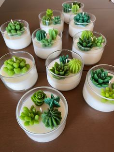 there are many small succulents in the bowls on the table with each other