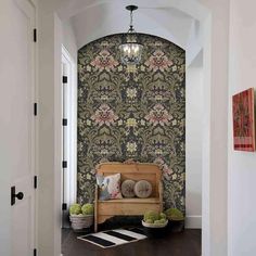 a hallway with a bench and wall paper