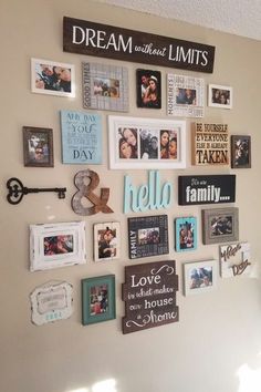 a wall with many pictures on it and a key hanging from the wall above them