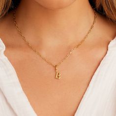 Description Personalize your favorite chain necklace with this playful helium alphabet charm. Wear your initials or a loved one's - you can make a set here. Product Details Total drop 11/16" Letter measures 5/16" by 3/8" Hinge closure measures 3/16" by 5/16" Available in 18k gold plated brass Avoid contact with anything containing derivatives of alcohol Dainty Initial Necklace With Charms For Personalized Gift, Dainty Initial Necklace With Charms, Classic Initial Pendant Charm Necklace, Classic Initial Pendant Charm Necklaces, Gold Classic Initial Necklace With Charms, Dainty Initial Pendant Name Necklace With Charms, Everyday Personalized Initial Pendant Charm Necklace, Personalized Initial Pendant Charm Necklace For Everyday, Gold Initial Necklace With Charms