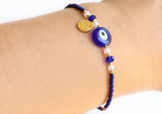 "This evil eye bracelet is made with navy blue evil eye and seed beads, navy blue gemstones, little pearls and, Ottoman Sultan's signature coin charms. This navy blue bracelet is 6.7\" (17 cm.) long. If you need other special size, please tell me. I will adjust length. Please visit my store to see the other handmade and evil eye jewelry https://www.etsy.com/shop/asteriascollection" Evil Eye Bracelet Diy, Evil Eye Jewelry Bracelet, Gift For Friends Birthday, Blue Evil Eye Bracelet, Christmas Gift For Friends, Jewelry Accessories Ideas, Feather Jewelry, Summer Bracelets, Blue Evil Eye