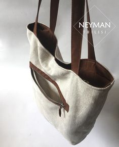 This beige thick canvas furniture textile bag is highly durable and comfortable for every day use. Its simple design makes it perfect for any and every occasion like work, shopping, beach, going out etc. The bag is really very roomy, so you can use it as travel bag as well. The combination of beige canvas and brown vegan suede leather elements gives the bag a unique look. The wide handles comfortably fit your shoulders. It has a big side pocket with zipper. The medium inner pocket is perfect for Rectangular Cream Canvas Bag, Cream Rectangular Canvas Bags, Large Capacity Cream Canvas Shoulder Bag, White Cotton Canvas Bag With Leather Handles, White Canvas Tote Bag With Removable Pouch, Modern Beige Canvas Bag With Removable Pouch, Eco-friendly Large Capacity Beige Canvas Bag, Cream Canvas Rectangular Shoulder Bag, Modern White Canvas Bag For Everyday