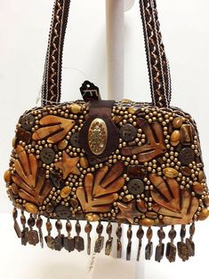 Beautiful new Far Nine brown beaded fall evening clutch purse. This purse is fully beaded and measures 5" in high, 2"in depth and 8" wide. NEW WITH TAG