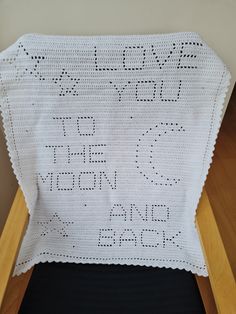 a crocheted baby blanket with the words you got to moon on it