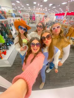 a group of women taking a selfie in a store