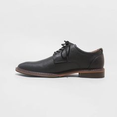 From formal meetings and events to family functions, these Leo Oxford Dress Shoes from Goodfellow & Co™ are a great pick to complete your ensemble. These medium-width shoes feature a cushioned footbed for comfy wear, making them great for both special occasion and everyday wear. With a sleek upper with stitched detailing and a lace-up front, they're perfect for creating a sharp, stylish look. Goodfellow & Co™: Where style & fit are always in good company. Classic Formal Lace-up Shoes With Ortholite Insole, Synthetic Leather Lace-up Shoes For Formal Occasions, Business Dress Shoes With Round Toe In Synthetic, Plain Toe Synthetic Dress Shoes For Work, Business Casual Dress Shoes With Textured Sole, Synthetic Plain Toe Dress Shoes For Work, Semi-formal Dress Shoes With Textured Sole, Black Dress Shoes With Ortholite Insole For Work, Formal Wingtip Leather Shoes With Cushioned Footbed