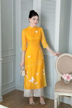 Very elegant design Silk Ao Dai For Party, Elegant Long Ao Dai For Summer, Elegant Fitted Ao Dai For Spring, Fitted Elegant Ao Dai For Spring, Chic Long Yellow Dress, Yellow Spring Midi Dress For Wedding, Festive Yellow Short Sleeve Dress, Yellow Midi Dress For Spring Wedding, Festive Yellow Formal Dress