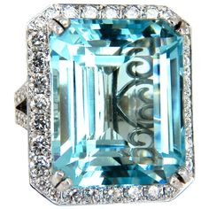 Avis Diamond Aquamarine Collections GIA Certified 42.01ct. Natural Aquamarine Ring Excellent clean clarity Octagonal Step cut (emerald cut). Vivid Blue Aqua color. Brilliant sparkles from all angles Pristine Transparency Report: 1176622726 23.31 x 19.19 x 12.97mm 4.00ct natural side round diamonds Vs-2 Clarity, G-color 18kt. white gold 28.4 grams. Deck of ring: 28 x 24mm depth of ring: 15mm current ring size: 7.75 can be resized (complimentary) $60,000 appraisal certificate will accompany & GIA Report. Natural Blue Diamond, Ladies Rings, 14k White Gold Diamond Ring, Contemporary Engagement Rings, Emerald Cut Rings, Modern Engagement Rings, Diamond Jewelry Designs, Blue Sapphire Diamond, Aquamarine Jewelry