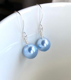 Something Blue, Light Blue Swarovski Pearl Earrings, Blue Swarovski Jewelry, Womens Earrings, Gift for Her, Bridal Pearl Earrings, UK Stunning light blue Swarovski pearl earrings. These are are extremely beautiful. Perfect as a gift to someone special or a little treat for you. Fabulous too as wedding earrings for the bride, bridesmaids or mother of the bride or groom. This beauty is super light and comfortable to wear.  Completed with 10 mm Swarovski pearls in a light blue shade and mini silver Nickel-free Blue Pearl Earrings Gift, Handmade Blue Pearl Earrings In Sterling Silver, Blue Sterling Silver Pearl Earrings As Gift, Handmade Blue Sterling Silver Pearl Earrings, Blue Teardrop Sterling Silver Pearl Earrings, Bridal Pearl Earrings, Earrings Patterns, Womens Earrings, Bridal Earrings Pearl