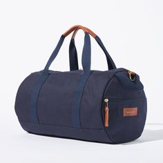 Sporty pals, we’ve had our not-so-sporty-bags stolen just one too many times, so we made you your own. Fabricated of our durable yet lightweight 12 oz canvas and accented with tonal navy webbing this is the perfect grab and go bag. A pair of sneakers, change of clothes, and shower essentials and we’ll have you from the gym to the office in no time. Carry the duffle with the handles or sling it over your shoulder with the removable strap. Classic Cotton Canvas Bag, Casual Duck Canvas Travel Bag For Everyday, Casual Canvas Travel Bag For Daily Use, Functional Coated Canvas Bag For Everyday Use, Casual Everyday Coated Canvas Travel Bag, Casual Weekender Bag With Canvas Lining For Everyday, Functional Everyday Coated Canvas Bag, Classic Canvas Bag With Leather Trim, Functional Weekender Bag With Canvas Lining