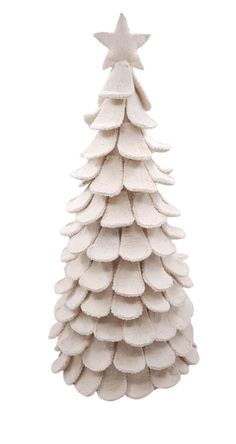 a small white christmas tree on a white background