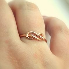 This Infinity Knot Ring is a dainty ring that shows your forever love, friendship, and appreciation for a special someone whether it be a wife, girlfriend, daughter, sister, or best friend. 14K Gold Filled Infinity Knot Ring Band just over 1mm thick This ring is also available in Rose Gold-filled and Sterling Silver. Adjustable Infinity Stackable Rings For Anniversary, Adjustable Infinity Stackable Anniversary Rings, Adjustable Infinity Promise Ring, Rose Gold Infinity Jewelry For Promise, Rose Gold Infinity Promise Jewelry, Personalized Adjustable Infinity Rings, Hypoallergenic Infinity Ring For Anniversary, Dainty Infinity Stackable Promise Rings, Adjustable Infinity Stackable Rings Gift