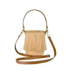 Frayed Mini Bucket 100% Toquilla Straw. This material is known for its quality and beauty. Each bag is entirely hand-made, from the straw dye to the weaving of the bag. -Measures approximately High: 15 Cm Width: 11 Cm Handle: 14 Cm - We ship with DHL Express. Shipping takes approximately 3 to 5 days to arrive depending on the destination. -Need Help? Please contact: customercare@sensistudio.com -All Sales Are Final. Luxury Straw Bucket Bag With Woven Leather, Luxury Woven Leather Straw Bucket Bag, Woven Leather Bucket Shoulder Bag, Chic Cream Woven Bucket Bag, Elegant Straw Bucket Bag With Woven Leather, Brown Bamboo Handle Bucket Shoulder Bag, Beige Leather Basket Bucket Bag, Luxury Beige Woven Leather Bucket Bag, Luxury Woven Straw Bag In Natural Color