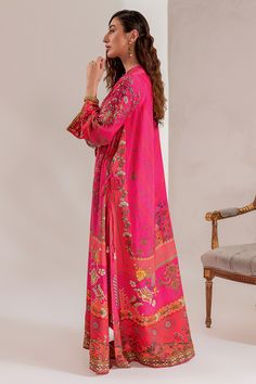 Maria B Pakistani Eid Dress in Raw Silk Kameez Trouser Style is an embroidered masterpiece that will give you a traditional and glamorous look on the festive occasion. Lavish designs, floral motifs, and hand-worked embellishments enhance the charm of this Pakistani Party Dress. Detailed Description: SKU: PS1823 Detailing: Embroidery, Threads, Floral designs, Motifs, Sequins, Beads Color: Hot pink Fabric: Raw Silk Design: Fully Embroidered dress Event: Festive, Party wear Bollywood Silk Dresses For Eid, Eid Straight Kurta Dress With Multicolor Embroidery, Eid Multicolor Embroidery Straight Kurta Dress, Eid Multicolor Embroidered Straight Kurta Dress, Festive Semi-stitched Long Sleeve Kaftan, Designer Multicolor Embroidered Dress For Diwali, Festive Long Sleeve Semi-stitched Kaftan, Diwali Long Sleeve Dress With Intricate Embroidery, Bollywood Style Dress With Multicolor Embroidery In Raw Silk