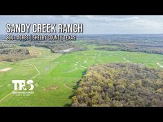 an aerial view of sandy creek ranch in the texas hill country with text reading sandy creek ranch